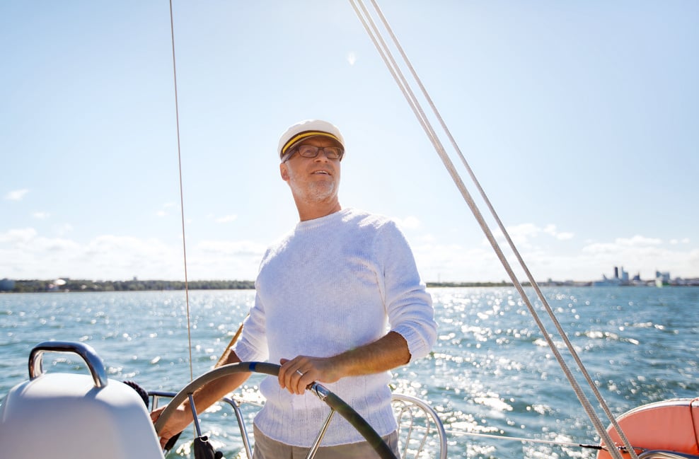 Senior Man at Helm on Boat